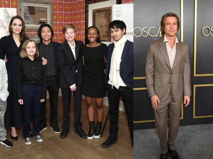 Angelina Jolie de pie con sus seis hijos. Brad Pitt con traje marrón en la alfombra roja.